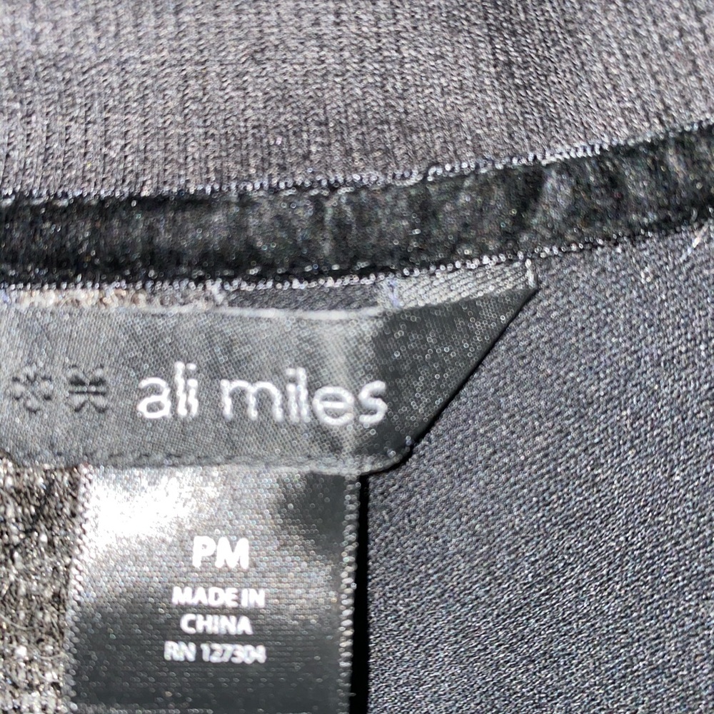 Light weight jacket, buttons down the front.